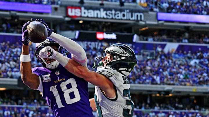 Oct 19, 2025; Minneapolis, Minnesota, USA; Minnesota Vikings wide receiver Justin Jefferson (18) is unable to make a catch during the second half after being blocked by Philadelphia Eagles cornerback Cooper Dejean (33) at U.S. Bank Stadium. Mandatory Credit: Jeffrey Becker-Imagn Images