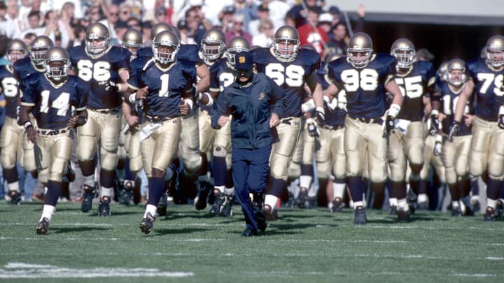 unknown date 1993; South Bend, IN, USA; FILE PHOTO; Notre Dame Irish head coach Lou Holtz leads his team onto the field during the 1993 season at Notre Dame Stadium. unknown date 1993; South Bend, IN, USA; FILE PHOTO; Notre Dame Irish head coach Lou Holtz leads his team onto the field during the 1993 season at Notre Dame Stadium.