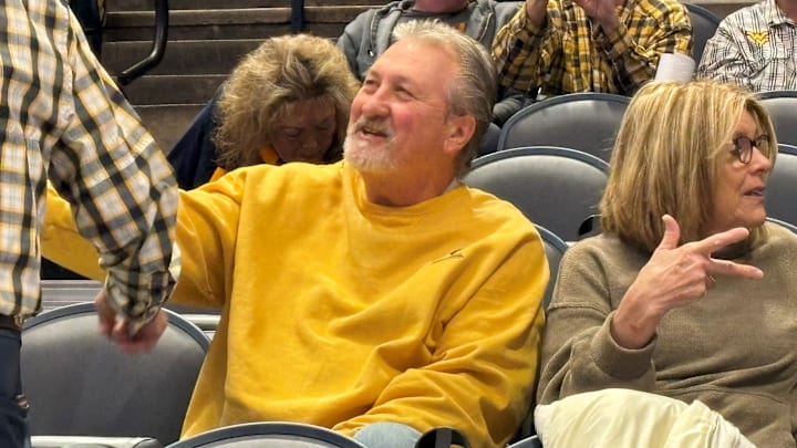 Former UC and West Virginia coach Bob Huggins sits in the stands at WVU Coliseum with his wife June for the Bearcats and Mountaineers game. Former UC and West Virginia coach Bob Huggins sits in the stands at WVU Coliseum with his wife June for the Bearcats and Mountaineers game.