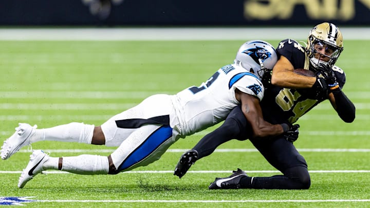 Sep 8, 2024; New Orleans, Louisiana, USA;  Carolina Panthers cornerback Michael Jackson (2) tackles New Orleans Saints wide receiver Mason Tipton (84) during the first half at Caesars Superdome. Mandatory Credit: Stephen Lew-Imagn Images