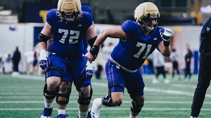 Davit Boyajyan (71) comes off the line with John Mills behind him. 