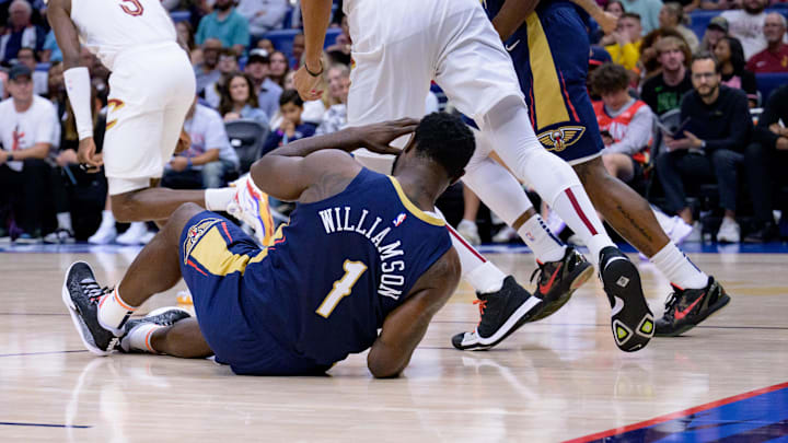 Nov 6, 2024; New Orleans, Louisiana, USA; New Orleans Pelicans forward Zion Williamson (1) falls on the court against the Cleveland Cavaliers during the first half at Smoothie King Center. Mandatory Credit: Matthew Hinton-Imagn Images