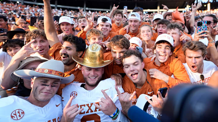 Texas Longhorns quarterback Quinn Ewers and Michael Taaffe celebrate following the Red River Rivalry Texas Longhorns quarterback Quinn Ewers and Michael Taaffe celebrate following the Red River Rivalry