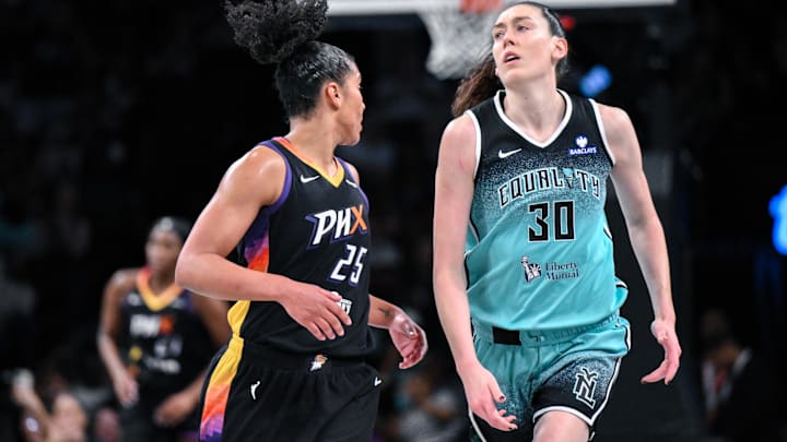 Jun 19, 2025; Brooklyn, New York, USA; New York Liberty forward Breanna Stewart (30) reacts as Phoenix Mercury forward Alyssa Thomas (25) defends during the second half at Barclays Center. Mandatory Credit: John Jones-Imagn Images