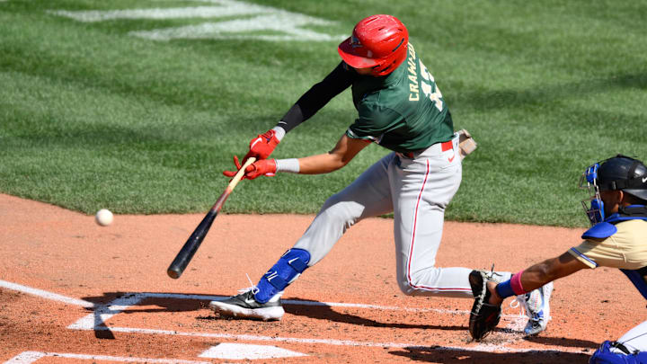 Jul 8, 2023; Seattle, Washington, USA; National League Futures designated hitter Justin Crawford (13) of the Philadelphia Phillies hits an RBI sacrifice fly against the American League during the second inning of the All Star-Futures game at T-Mobile Park. Jul 8, 2023; Seattle, Washington, USA; National League Futures designated hitter Justin Crawford (13) of the Philadelphia Phillies hits an RBI sacrifice fly against the American League during the second inning of the All Star-Futures game at T-Mobile Park.