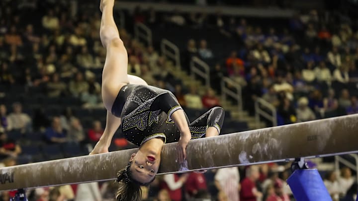 Mar 18, 2023; Duluth, GA, USA; Missouri Tigers gymnast Helen Hu competes on the  balance beam during the SEC Gymnastics Championship at Gas South Arena. Mandatory Credit: Dale Zanine-Imagn Images