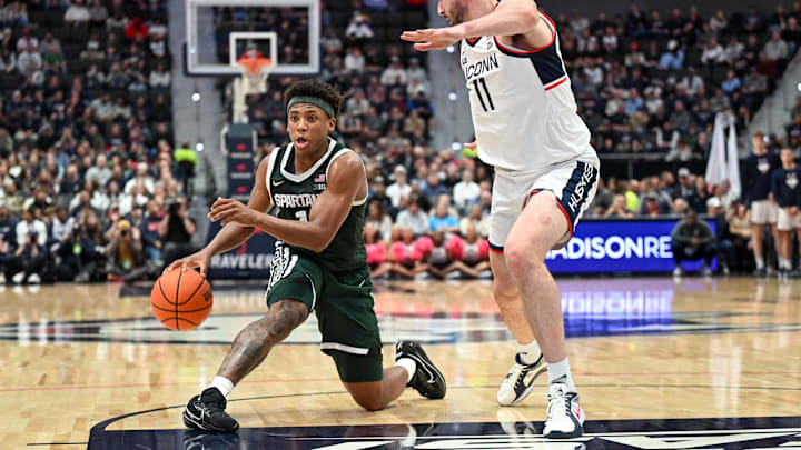 Oct 28, 2025; Hartford, CT, USA; Michigan State Spartans guard Jeremy Fears Jr. (1) dribbles the ball against Connecticut Huskies forward Alex Karaban (11) during the second half at PeoplesBank Arena. Mandatory Credit: Mark Smith-Imagn Images Oct 28, 2025; Hartford, CT, USA; Michigan State Spartans guard Jeremy Fears Jr. (1) dribbles the ball against Connecticut Huskies forward Alex Karaban (11) during the second half at PeoplesBank Arena. Mandatory Credit: Mark Smith-Imagn Images