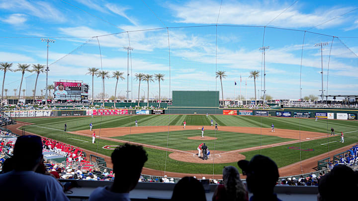 Fans gather to watch a Cactus League game between the Cincinnati Reds and Los Angeles Dodgers, Monday, Feb. 24, 2025, at Goodyear Ballpark in Goodyear, Ariz.