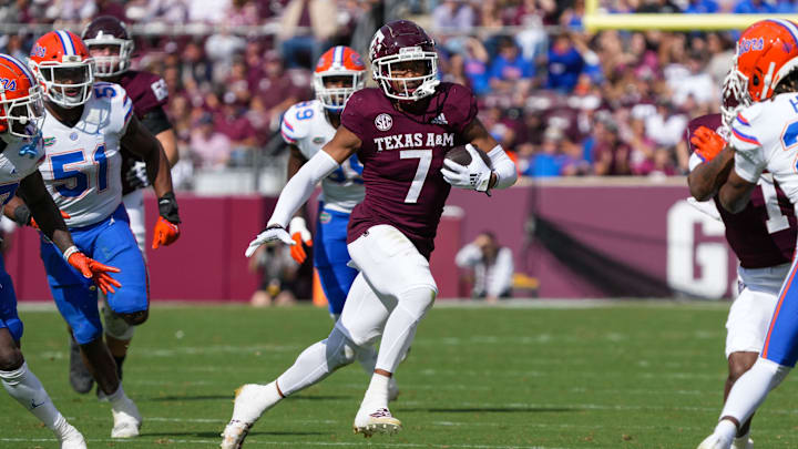 Texas A&M Aggies wide receiver Moose Muhammad III (7) runs the ball in the first half against the Florida Gators at Kyle Field. Texas A&M Aggies wide receiver Moose Muhammad III (7) runs the ball in the first half against the Florida Gators at Kyle Field.