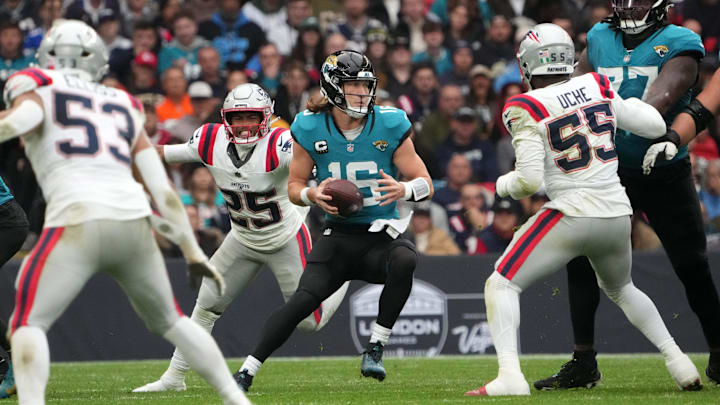 Oct 20, 2024; London, United Kingdom; Jacksonville Jaguars quarterback Trevor Lawrence (16) prepares to throw the ball against the New England Patriots in the second half of an NFL International Series game at Wembley Stadium. Mandatory Credit: Kirby Lee-Imagn Images