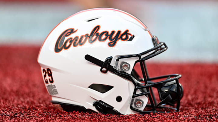 Nov 18, 2023; Houston, Texas, USA; A detailed view of an Oklahoma State Cowboys helmet on the sideline of the game against the Houston Cougars at TDECU Stadium. Mandatory Credit: Maria Lysaker-Imagn Images