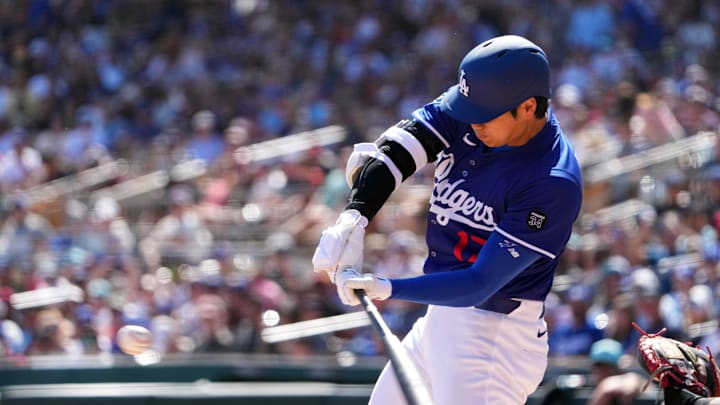 Ohtani swings during Dodgers spring training.