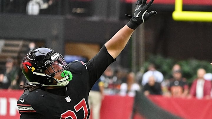 Nov 16, 2025; Glendale, Arizona, USA; San Francisco 49ers quarterback Brock Purdy (13) throws the ball while Arizona Cardinals defensive lineman Walter Nolen III (97) defends in the first half at State Farm Stadium. Mandatory Credit: Matt Kartozian-Imagn Images