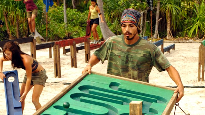 Ozzy Lusth, pictured here during season 13 “SURVIVOR: COOK ISLANDS” will return to compete on the milestone Season 50 of SURVIVOR, premiering Spring 2026 on CBS and Paramount+. Ozzy previously appears on seasons 13 (COOK ISLANDS), 16 (MICRONESIA – FANS VS. FAVORITES), 23 (SOUTH PACIFIC), and 34 (GAME CHANGERS). Photo: Jeffrey R. Staab/CBS ©2006 CBS Broadcasting Inc. All Rights Reserved. Ozzy Lusth, pictured here during season 13 “SURVIVOR: COOK ISLANDS” will return to compete on the milestone Season 50 of SURVIVOR, premiering Spring 2026 on CBS and Paramount+. Ozzy previously appears on seasons 13 (COOK ISLANDS), 16 (MICRONESIA – FANS VS. FAVORITES), 23 (SOUTH PACIFIC), and 34 (GAME CHANGERS). Photo: Jeffrey R. Staab/CBS ©2006 CBS Broadcasting Inc. All Rights Reserved.