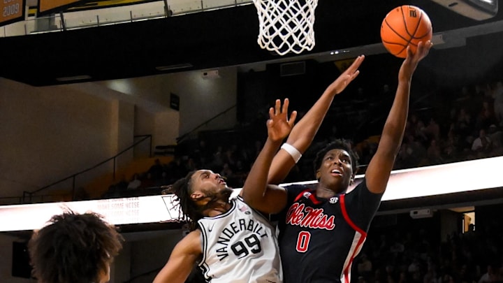 Feb 22, 2025; Nashville, Tennessee, USA;  Mississippi Rebels forward Malik Dia (0) shoots over Vanderbilt Commodores forward Devin McGlockton (99) during the second half at Memorial Gymnasium. Mandatory Credit: Steve Roberts-Imagn Images