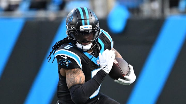 Dec 21, 2025; Charlotte, North Carolina, USA; Carolina Panthers running back Rico Dowdle (5) with the ball in the fourth quarter at Bank of America Stadium. Mandatory Credit: Bob Donnan-Imagn Images