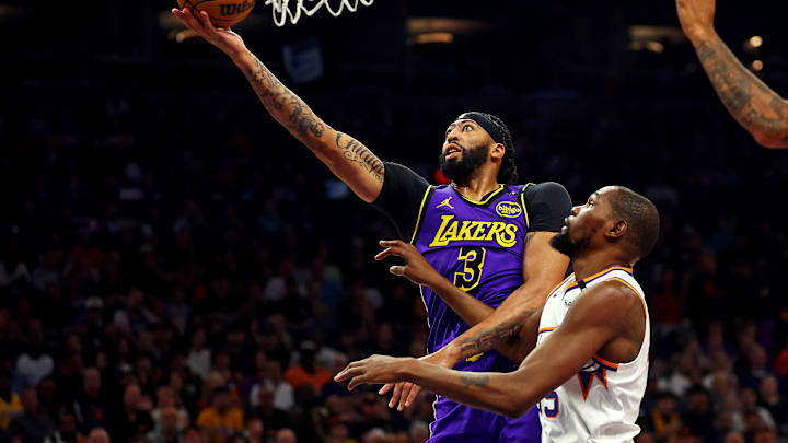 Oct 28, 2024; Phoenix, Arizona, USA; Los Angeles Lakers forward Anthony Davis (3) shoots the ball against Phoenix Suns forward Kevin Durant (35) during the first quarter at Footprint Center. Mandatory Credit: Mark J. Rebilas-Imagn Images