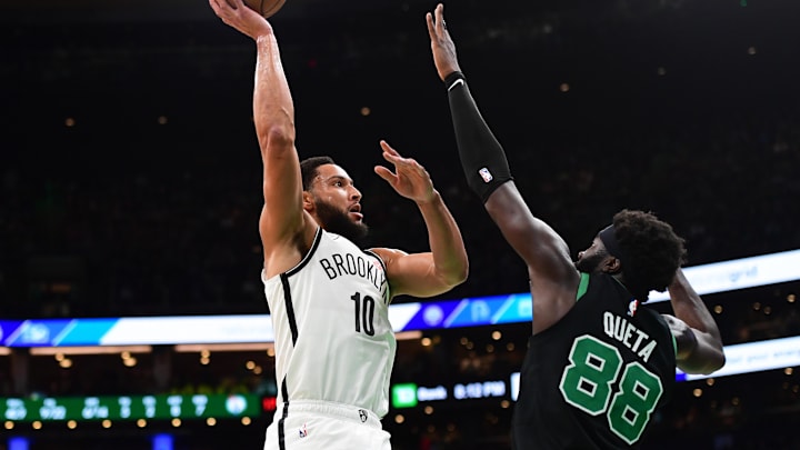 Nov 8, 2024; Boston, Massachusetts, USA;  Brooklyn Nets guard Ben Simmons (10) shoots the ball over Boston Celtics center Neemias Queta (88) during the first half at TD Garden. Mandatory Credit: Bob DeChiara-Imagn Images