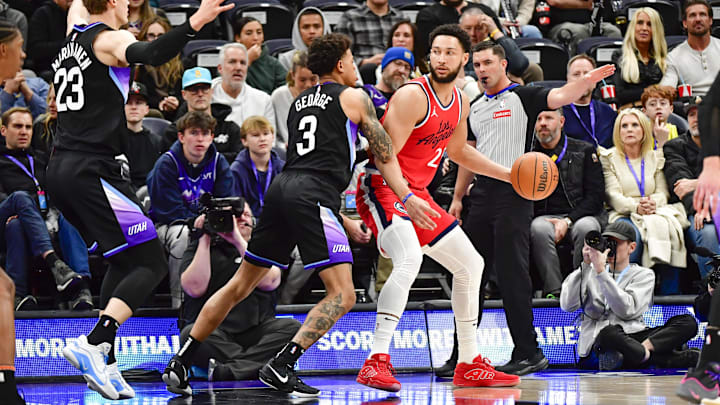 Feb 13, 2025; Salt Lake City, Utah, USA; Utah Jazz guard Keyonte George (3) defends LA Clippers guard/forward Ben Simmons (25) during the first half at the Delta Center. Mandatory Credit: Christopher Creveling-Imagn Images