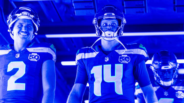Aug 15, 2025; Seattle, Washington, USA; Seattle Seahawks quarterback Drew Lock (2) and quarterback Sam Darnold (14) exit the locker room for pregame warmups against the Kansas City Chiefs at Lumen Field. Mandatory Credit: Joe Nicholson-Imagn Images