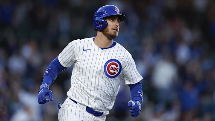 May 7, 2024; Chicago, Illinois, USA; Chicago Cubs outfielder Cody Bellinger (24) watches his solo home run against the San Diego Padres during the fourth inning at Wrigley Field. May 7, 2024; Chicago, Illinois, USA; Chicago Cubs outfielder Cody Bellinger (24) watches his solo home run against the San Diego Padres during the fourth inning at Wrigley Field.