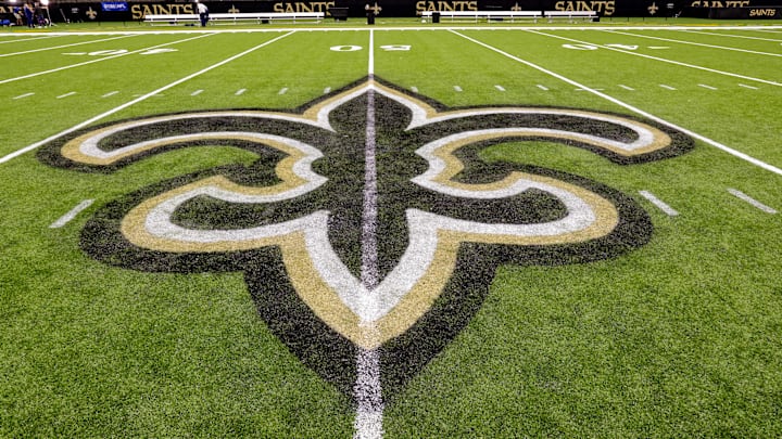 Oct 30, 2022; New Orleans, Louisiana, USA; General view of the New Orleans Saints logo as the midfield logo fleur-de-lis after the game between the New Orleans Saints and the Las Vegas Raiders at Caesars Superdome. Mandatory Credit: Stephen Lew-Imagn Images Oct 30, 2022; New Orleans, Louisiana, USA; General view of the New Orleans Saints logo as the midfield logo fleur-de-lis after the game between the New Orleans Saints and the Las Vegas Raiders at Caesars Superdome. Mandatory Credit: Stephen Lew-Imagn Images