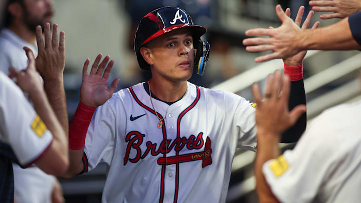 Sep 3, 2024; Atlanta, Georgia, USA; Atlanta Braves third baseman Gio Urshela (9) celebrates with teammates after scoring a run against the Colorado Rockies in the third inning at Truist Park. Mandatory Credit: Brett Davis-Imagn Images
Sep 3, 2024; Atlanta, Georgia, USA; Atlanta Braves third baseman Gio Urshela (9) celebrates with teammates after scoring a run against the Colorado Rockies in the third inning at Truist Park. Mandatory Credit: Brett Davis-Imagn Images