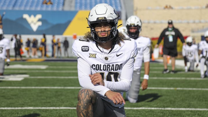 Nov 8, 2025; Morgantown, West Virginia, USA; Colorado Buffaloes quarterback Julian Lewis (10) warms up prior to their game against the West Virginia Mountaineers at Milan Puskar Stadium. Mandatory Credit: Ben Queen-Imagn Images