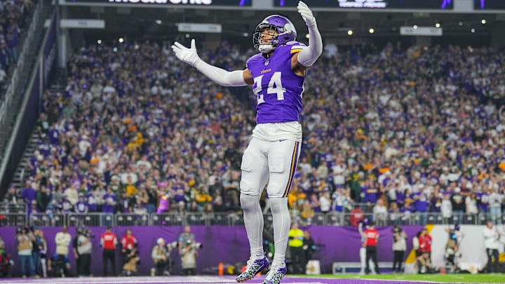 Dec 29, 2024; Minneapolis, Minnesota, USA; Minnesota Vikings safety Camryn Bynum (24) interacts with fans against Green Bay Packers in the first quarter at U.S. Bank Stadium. Mandatory Credit: Brad Rempel-Imagn Images