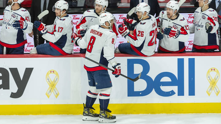 Jan 30, 2025; Ottawa, Ontario, CAN; Washington Capitals left wing Alex Ovechkin (8) celebrates with team his goal scored in the third period against the  Ottawa Senators at the Canadian Tire Centre. Mandatory Credit: Marc DesRosiers-Imagn Images
