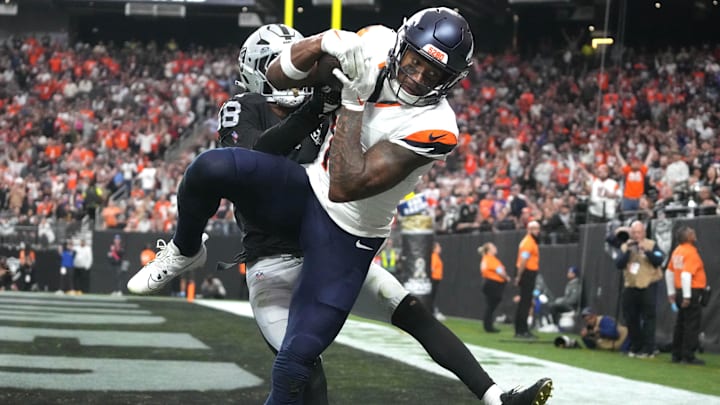 Nov 24, 2024; Paradise, Nevada, USA; Denver Broncos wide receiver Courtland Sutton (14) catches an 18-yard touchdown pass against Las Vegas Raiders cornerback Jack Jones (18) in the third quarter at Allegiant Stadium. 