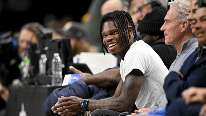 Jan 22, 2025; Dallas, Texas, USA; 2024 Heisman Trophy winner Travis Hunter Jr. laughs during the second half of the game between the Dallas Mavericks and the Minnesota Timberwolves at the American Airlines Center. Mandatory Credit: Jerome Miron-Imagn Images Jan 22, 2025; Dallas, Texas, USA; 2024 Heisman Trophy winner Travis Hunter Jr. laughs during the second half of the game between the Dallas Mavericks and the Minnesota Timberwolves at the American Airlines Center. Mandatory Credit: Jerome Miron-Imagn Images