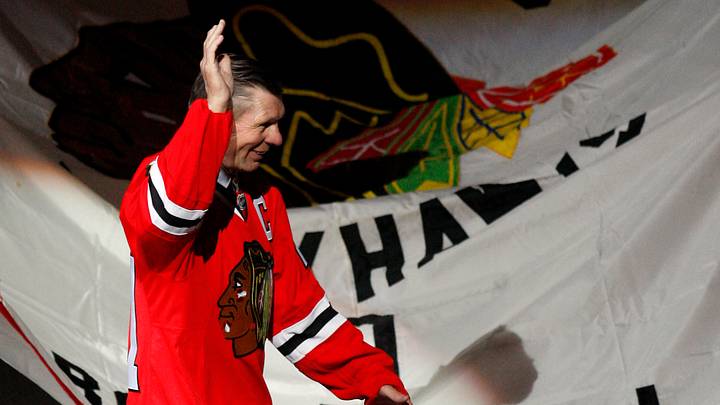 March 7, 2008; Chicago, IL, USA; Chicago Blackhawks former player Stan Mikita (21) walks past a banner for fellow former player Bobby Hull (not pictured) during a ceremony honoring their careers before the game against the San Jose Sharks at the United Center.  Mandatory Credit: Jerry Lai-USA TODAY Sports