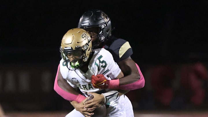Oaks Christian's Hayden Lowe brings down St. Bonaventure's quarterback Jaxson Carper during the second quarter of Oaks Christian's 35-0 Marmonte League win over visiting St. Bonaventure Friday at Redell Field.