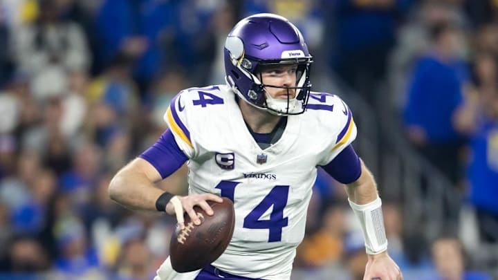 Jan 13, 2025; Glendale, AZ, USA; Minnesota Vikings quarterback Sam Darnold (14) against the Los Angeles Rams during an NFC wild card game at State Farm Stadium.  