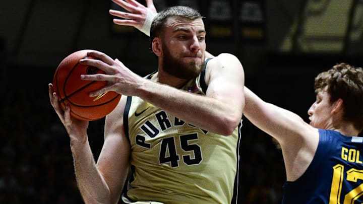 Purdue Boilermakers center Oscar Cluff (45) grabs a rebound Purdue Boilermakers center Oscar Cluff (45) grabs a rebound