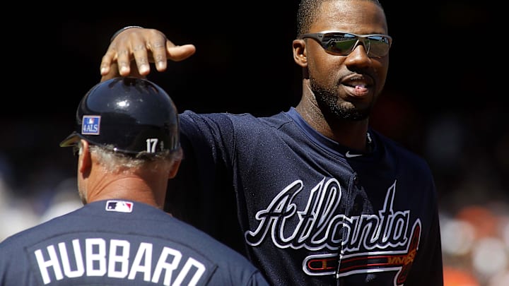 April 9, 2010; San Francisco, CA, USA; Atlanta Braves right fielder Jason Heyward (22) pats first base coach Glenn Hubbard (17) on the head after striking out against the San Francisco Giants in the third inning at AT&T Park. Mandatory Credit: Cary Edmondson-Imagn Images