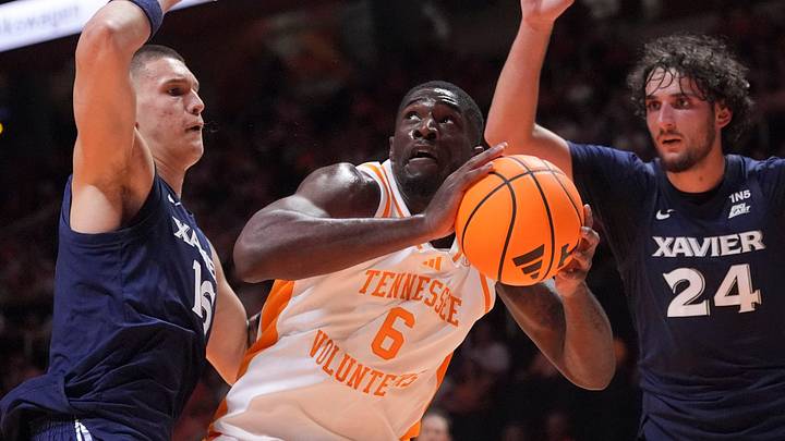 Tennessee forward DeWayne Brown II (6) looks for a chance to shoot while guarded by Xavier forward Nikos Chitikoudis (16) and Xavier forward Jovan Milicevic (24) during a college basketball exhibition game on Oct. 15, 2026, in Knoxville, Tennessee. Tennessee forward DeWayne Brown II (6) looks for a chance to shoot while guarded by Xavier forward Nikos Chitikoudis (16) and Xavier forward Jovan Milicevic (24) during a college basketball exhibition game on Oct. 15, 2026, in Knoxville, Tennessee.