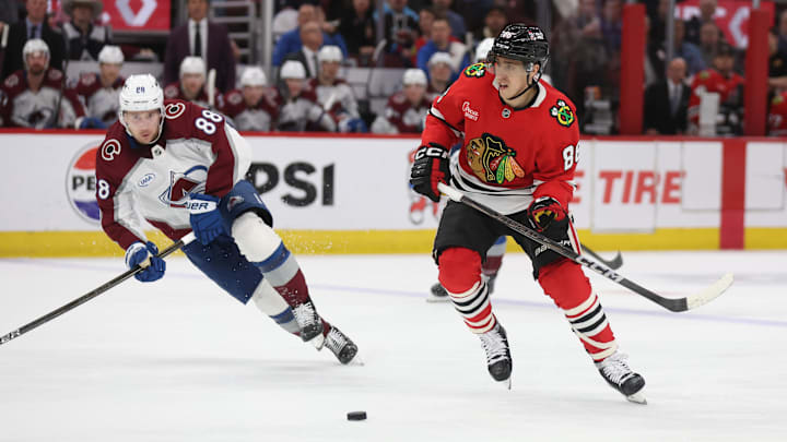 Apr 2, 2025; Chicago, Illinois, USA; Chicago Blackhawks center Teuvo Teravainen (86) and Colorado Avalanche center Martin Necas (88) battle for control of the puck during the third period at United Center. Mandatory Credit: Talia Sprague-Imagn Images