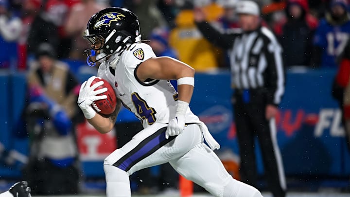 Jan 19, 2025; Orchard Park, New York, USA; Baltimore Ravens running back Keaton Mitchell (34) returns a kickoff against the Buffalo Bills in the fourth quarter of a 2025 AFC divisional round game against the Buffalo Bills at Highmark Stadium. Mandatory Credit: Mark Konezny-Imagn Images