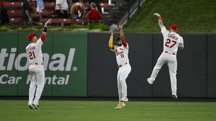 Sep 2, 2025; St. Louis, Missouri, USA; St. Louis Cardinals outfielder Lars Nootbaar (21) center fielder Victor Scott II (11) and right fielder Nathan Church (27) celebrate after the Cardinals defeated the Athletics at Busch Stadium. Mandatory Credit: Jeff Curry-Imagn Images Sep 2, 2025; St. Louis, Missouri, USA; St. Louis Cardinals outfielder Lars Nootbaar (21) center fielder Victor Scott II (11) and right fielder Nathan Church (27) celebrate after the Cardinals defeated the Athletics at Busch Stadium. Mandatory Credit: Jeff Curry-Imagn Images