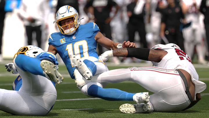 Sep 13, 2026; Inglewood, California, USA; Arizona Cardinals defensive line Dante Stills (55) tackles Los Angeles Chargers quarterback Justin Herbert (10) during the second quarter at SoFi Stadium. Mandatory Credit: Kiyoshi Mio-Imagn Images Sep 13, 2026; Inglewood, California, USA; Arizona Cardinals defensive line Dante Stills (55) tackles Los Angeles Chargers quarterback Justin Herbert (10) during the second quarter at SoFi Stadium. Mandatory Credit: Kiyoshi Mio-Imagn Images