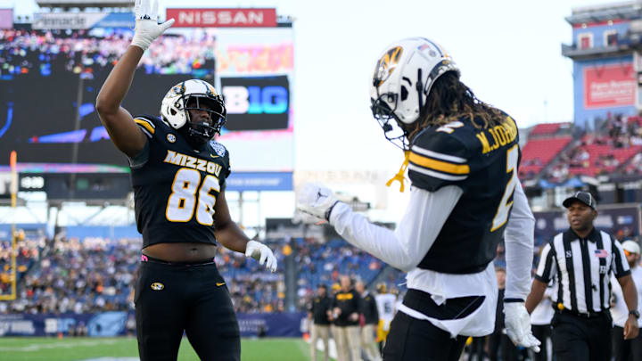Dec 30, 2024; Nashville, TN, USA;  Missouri Tigers wide receiver Marquis Johnson (2) celebrates with tight end Jordon Harris (86) after his touchdown against the Iowa Hawkeyes during the first half at Nissan Stadium. Mandatory Credit: Steve Roberts-Imagn Images