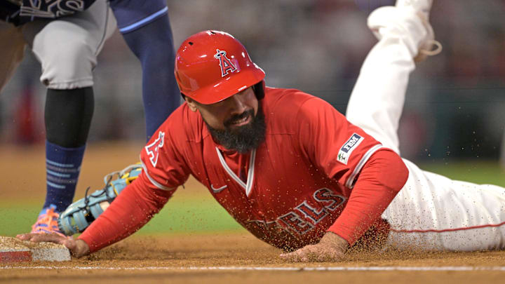 Apr 9, 2024; Anaheim, California, USA;  Los Angeles Angels third base Anthony Rendon (6) beats the tag as he dives back to first in the fourth inning against the Tampa Bay Rays at Angel Stadium. Mandatory Credit: Jayne Kamin-Oncea-USA TODAY Sports
