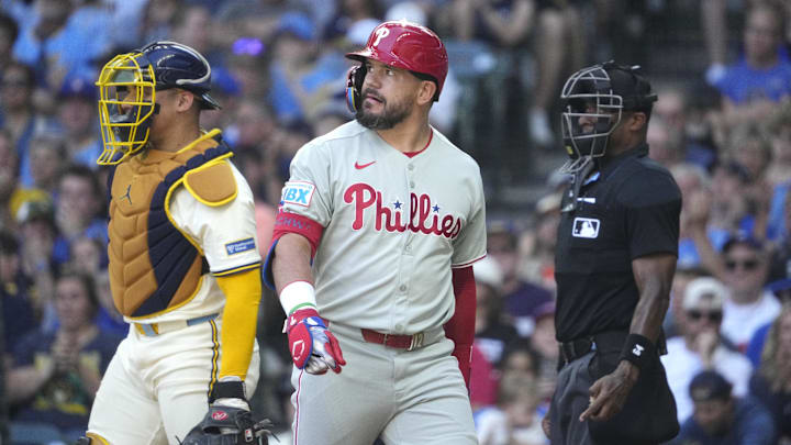 Sep 1, 2025; Milwaukee, Wisconsin, USA; Philadelphia Phillies outfielder Kyle Schwarber (12) looks at the replay board after striking out against the Milwaukee Brewers in the fourth inning at American Family Field. Mandatory Credit: Michael McLoone-Imagn Images