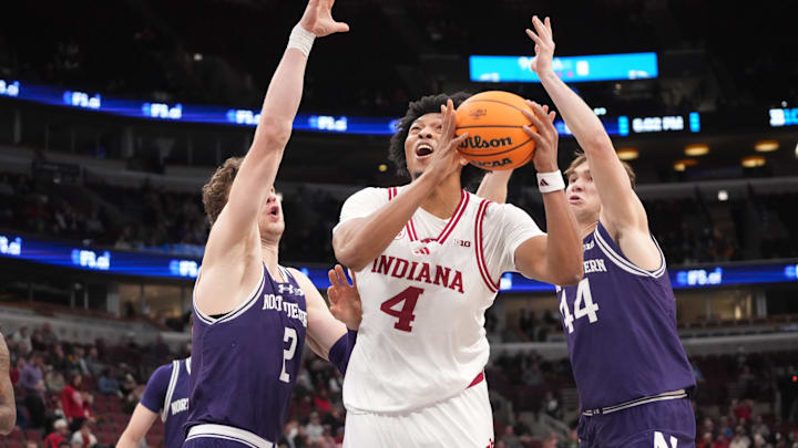 Mar 11, 2026; Chicago, IL, USA; Northwestern Wildcats forward Nick Martinelli (2) guard Angelo Ciaravino (44) defend Indiana Hoosiers forward Sam Alexis (4) during the first half at United Center. Mandatory Credit: David Banks-Imagn Images