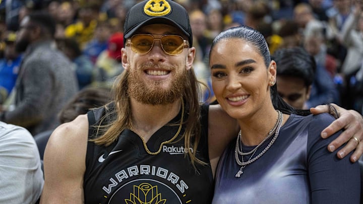 San Francisco 49ers tight end George Kittle and wife Claire Kittle at a game between Golden State Warriors and Philadelphia 76ers during the second quarter at Chase Center.