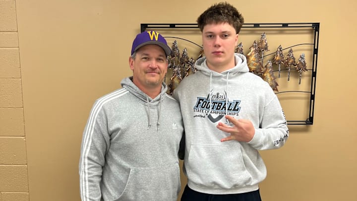 Titus Osterman entertains UW linebackers coach Brian Odom on a visit in Idaho. 