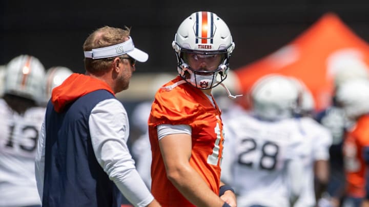 Auburn Tigers head coach Hugh Freeze talks with quarterback Jackson Arnold (11) during practice at Woltosz Football Performance Center in Auburn, Ala. on Thursday, Aug. 14, 2025.