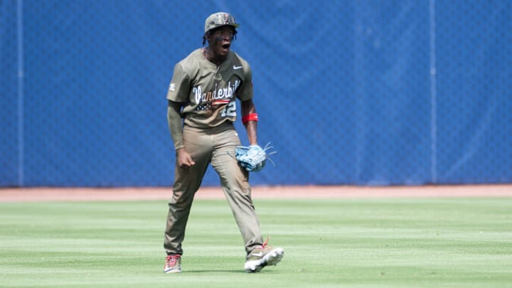 Vanderbilt Commodores' RJ Austin (42) celebrates after catching the final out as Ole Miss Rebels take on Vanderbilt Commodores during the SEC baseball tournament championship game at Hoover Met in Birmingham, Ala., on Sunday, May 25, 2025. Vanderbilt Commodores defeated Ole Miss Rebels 3-2.